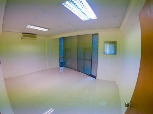 empty room with tiled floor and ceiling lights