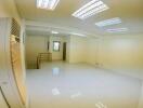 Spacious room with fluorescent lighting and air conditioning