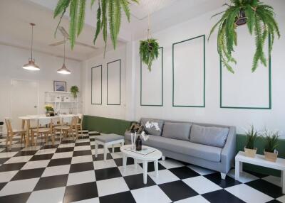 Modern living area with black and white checkered floor