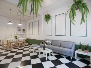 Modern living area with black and white checkered floor