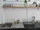 Modern kitchen sink area with dishes and glasses