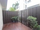 Balcony with wooden flooring and potted plants