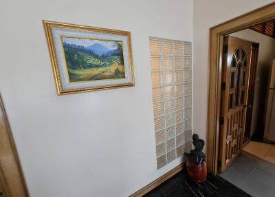 Hallway with artwork and decorative elements