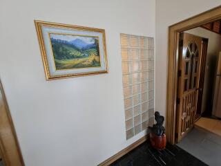 Hallway with artwork and decorative elements