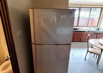 Kitchen with refrigerator and table