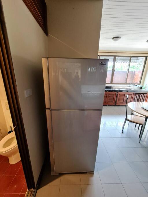 Kitchen with refrigerator and table