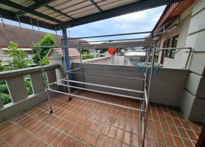 Covered balcony with metal drying rack