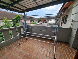 Covered balcony with metal drying rack