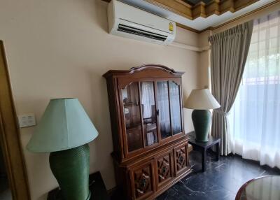 Living room with wooden cabinet and air conditioner