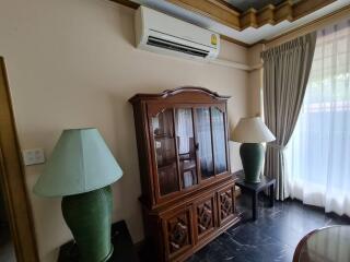 Living room with wooden cabinet and air conditioner