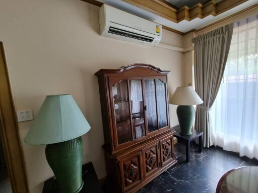 Living room with wooden cabinet and air conditioner