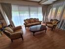 Living room with classic furniture and large windows