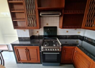 Kitchen with wooden cabinets and modern appliances