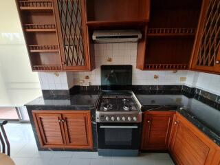 Kitchen with wooden cabinets and modern appliances