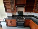 Kitchen with wooden cabinets and modern appliances