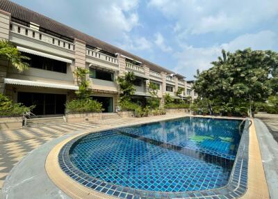 Outdoor view of a building with a swimming pool