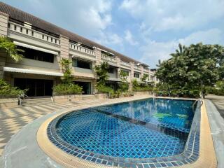 Outdoor view of a building with a swimming pool