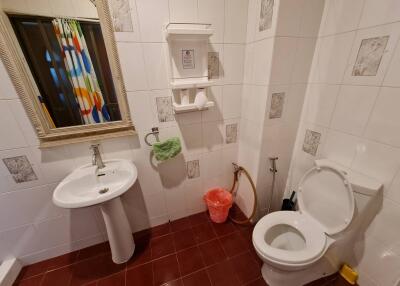 Bathroom with sink, toilet, and shower