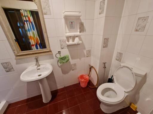 Bathroom with sink, toilet, and shower