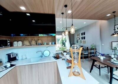 Modern kitchen with dining area in an open-concept living space