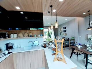 Modern kitchen with dining area in an open-concept living space