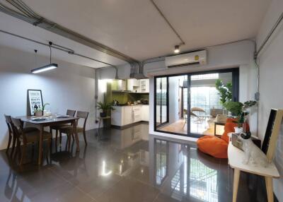 Spacious open-plan living area with kitchen and dining space