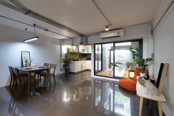 Spacious open-plan living area with kitchen and dining space