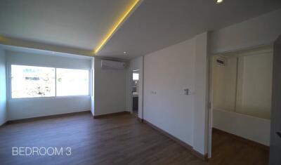 Spacious Bedroom with Modern Lighting