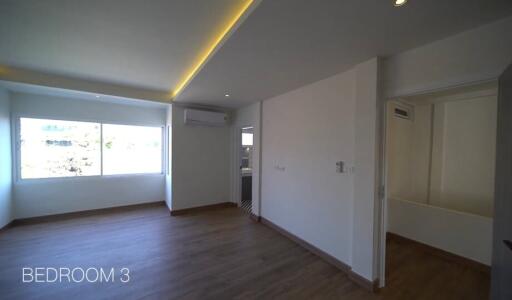 Spacious Bedroom with Modern Lighting