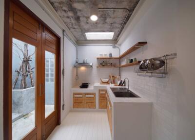 Modern kitchen with wooden accents and large glass doors