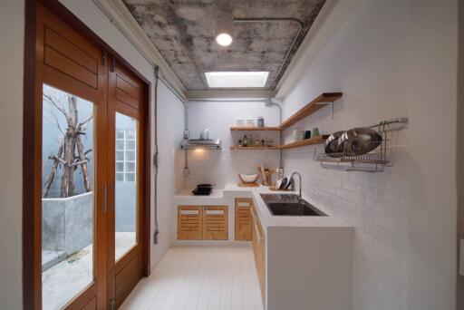 Modern kitchen with wooden accents and large glass doors