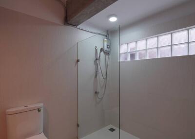 Modern bathroom with glass-enclosed shower