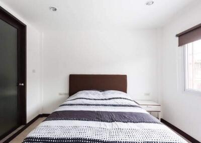 Modern and minimalistic bedroom with a large window