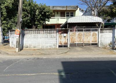 Front view of a building with a gated entrance