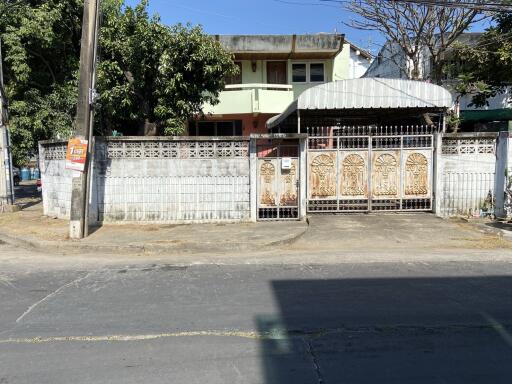 Front view of a building with a gated entrance