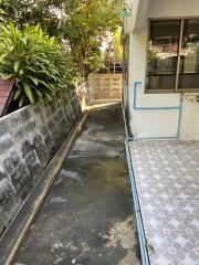 Narrow outdoor walkway beside building