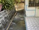 Narrow outdoor walkway beside building