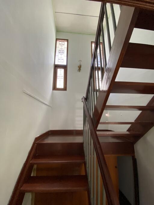 Staircase with wooden steps and railings