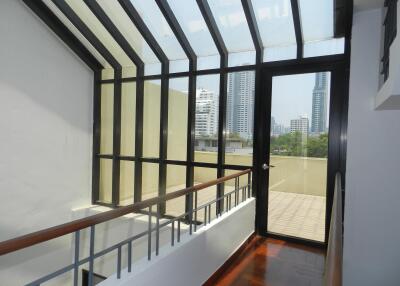 Skylight corridor with views of high-rise buildings