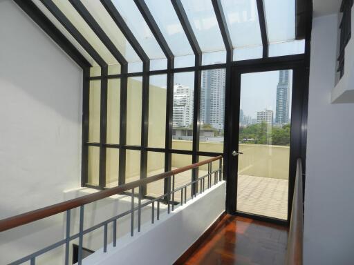 Skylight corridor with views of high-rise buildings