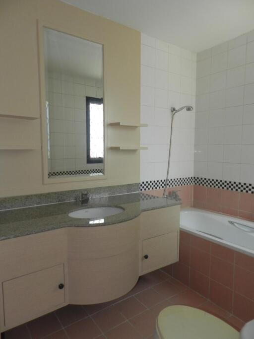 Bathroom with sink, mirror, and bathtub