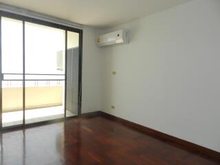 Living room with wooden flooring and air conditioning unit