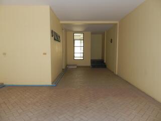 Empty room with tile flooring and a window