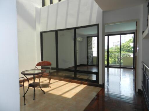 Main living area with glass doors leading to balcony