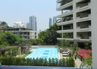 Outdoor swimming pool with surrounding buildings