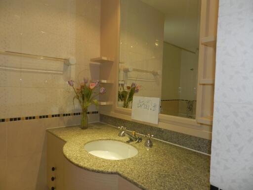 Bathroom with granite countertop and sink