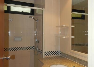 Bathroom with shower and vanity