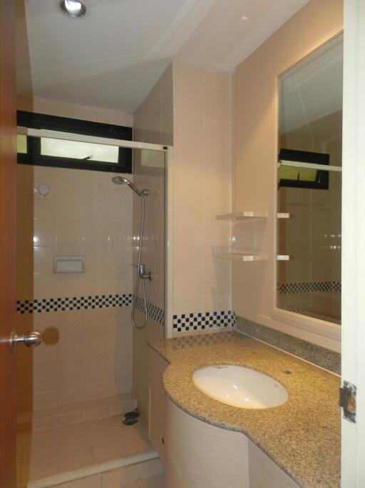 Bathroom with shower and vanity