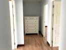 Hallway with wooden floor and dresser