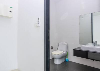 Modern bathroom with toilet and vanity